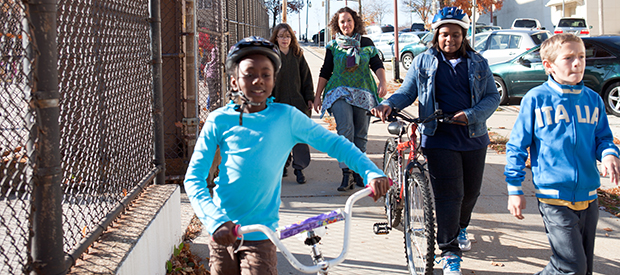 children walking to school on sidewalk